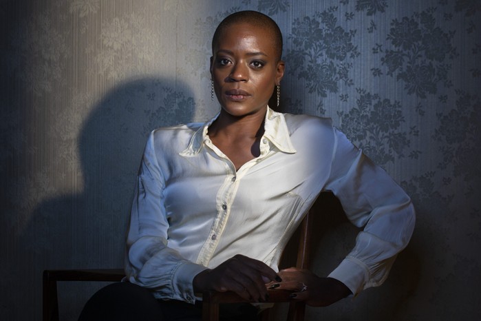 T'Nia Miller as Celeste in Years and Years sitting in a white shirt