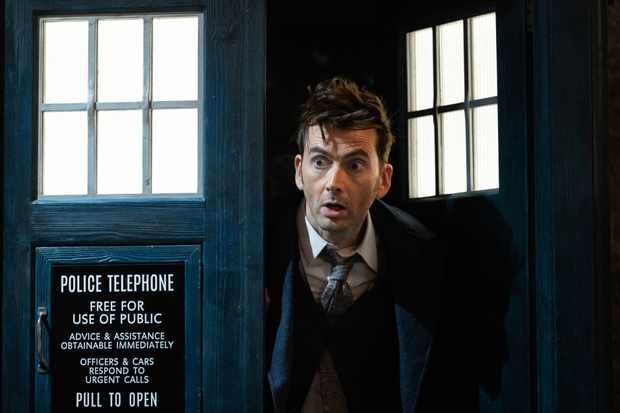 David Tennant as the Fourteenth Doctor in Doctor Who in the doorway of the TARDIS