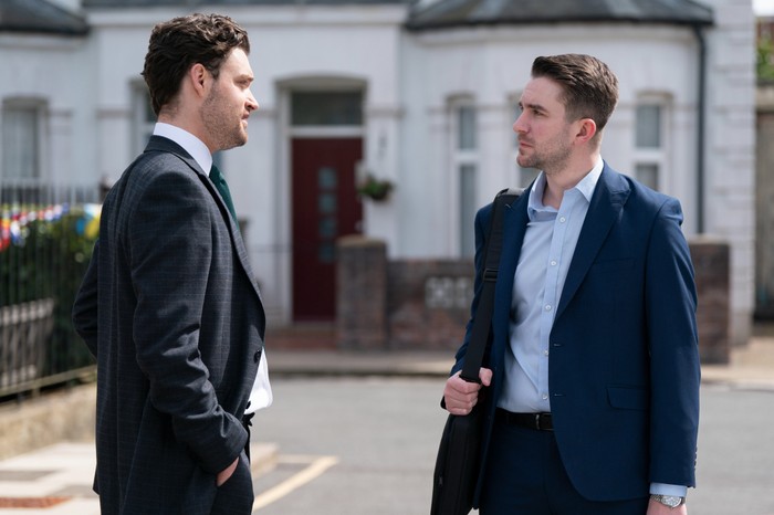 Johnny speaks to a stressed Callum, who holds a bag over his shoulder in EastEnders