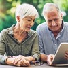 Shot of a senior couple using a digital tablet together in their backyard