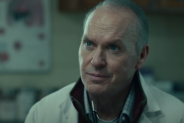 Michael Keaton stars in Dopesick wearing a white lab coat looking concerned