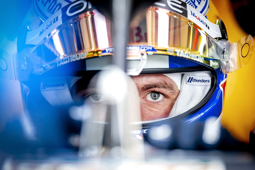 Close up of Max Verstappen staring at the camera in his Red Bull car