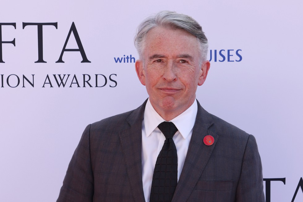 Steve Coogan in a suit at the BAFTAs