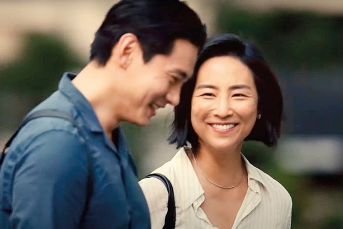 Greta Lee as Nora and Teo Yoo as Hae Sung in Past Lives smiling together