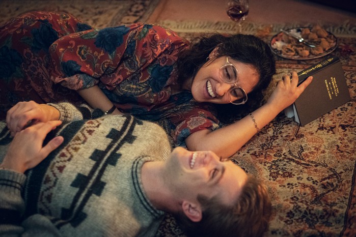 Dexter and Emma lying together on the floor laughing