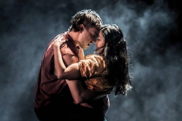 Paul Mescal and Anjana Vasan embracing against a stormy backdrop