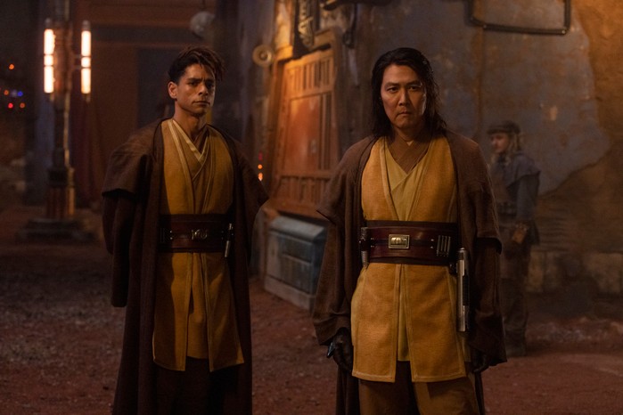 ord Fandar (Charlie Barnett) and Master Sol (Lee Jung-jae) in The Acolyte standing in Jedi robes looking concerned