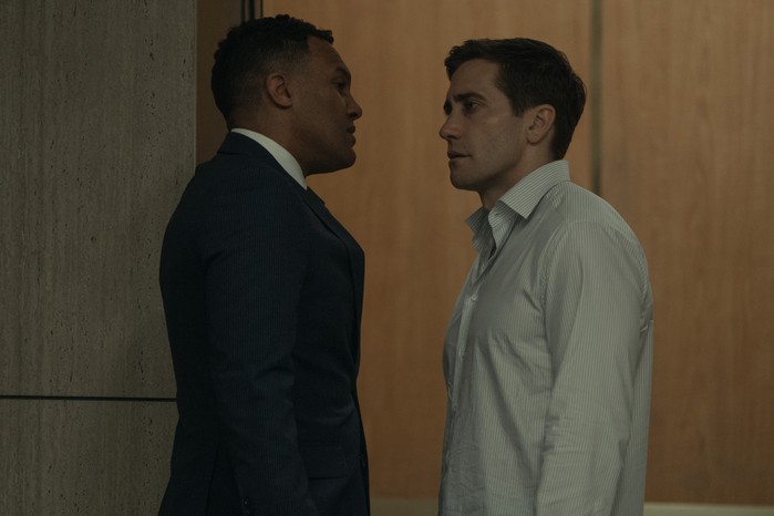 O-T Fagbenle and Jake Gyllenhaal in Presumed Innocent, stood next to each other and looking at each other