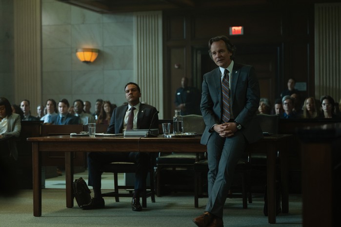 O-T Fagbenle and Peter Sarsgaard in Presumed Innocent, stood and sat in a court room