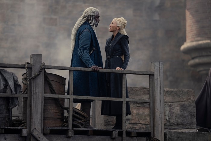 Steve Toussaint as Lord Corlys Velaryon standing on battlement with Eve Best as Princess Rhaenys Targaryen in House of the Dragon season 2.