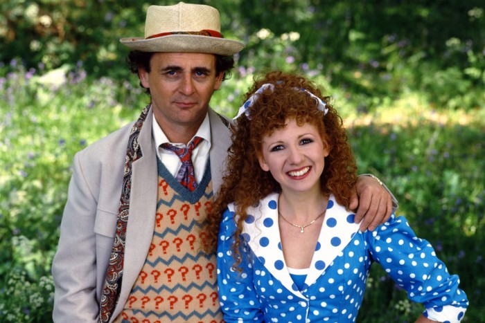 Sylvester McCoy in his Doctor Who costume with his arm around companion Bonnie Langford