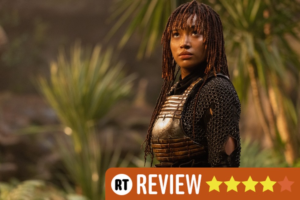 Amandla Stenberg as Osha in The Acolyte. She's surrounded by plants and is looking solemnly into the distance. An orange label in the bottom right corner reads "RT Review" with four out of five stars filled in