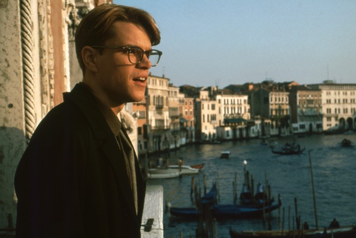 Matt Damon in The Talented Mr Ripley standing overlooking a canal in Venice