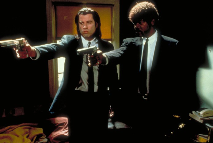 Pulp Fiction still showing John Travolta and Samuel L Jackson in suits holding pistols